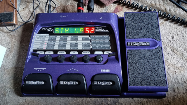 now-working DigiTech Vocal 300 with a cheap 1300ma 9VAC power adapter.
It's a large purple 8x12" effects unit with an 80's LED digital display and a treadle.
Display reads "5TH UP 52" - patch name and number.