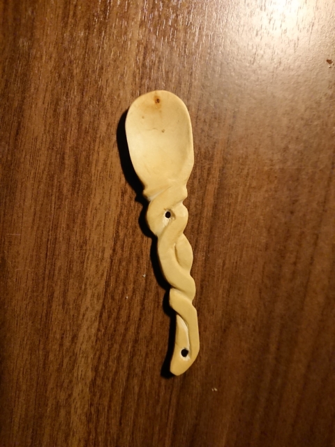 Twirly tiny wooden spoon.