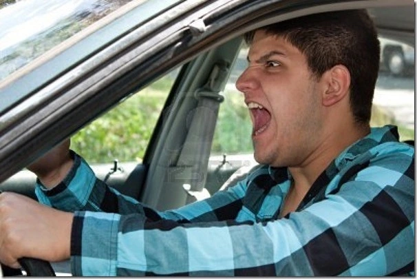 8053431-an-irritated-young-man-driving-a-vehicle-is-expressing-his-road-rage